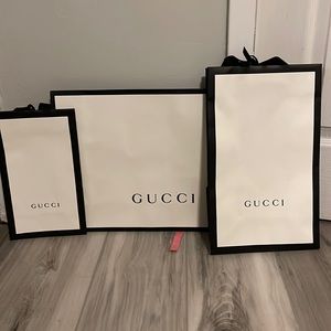 3 Gucci shopping bags